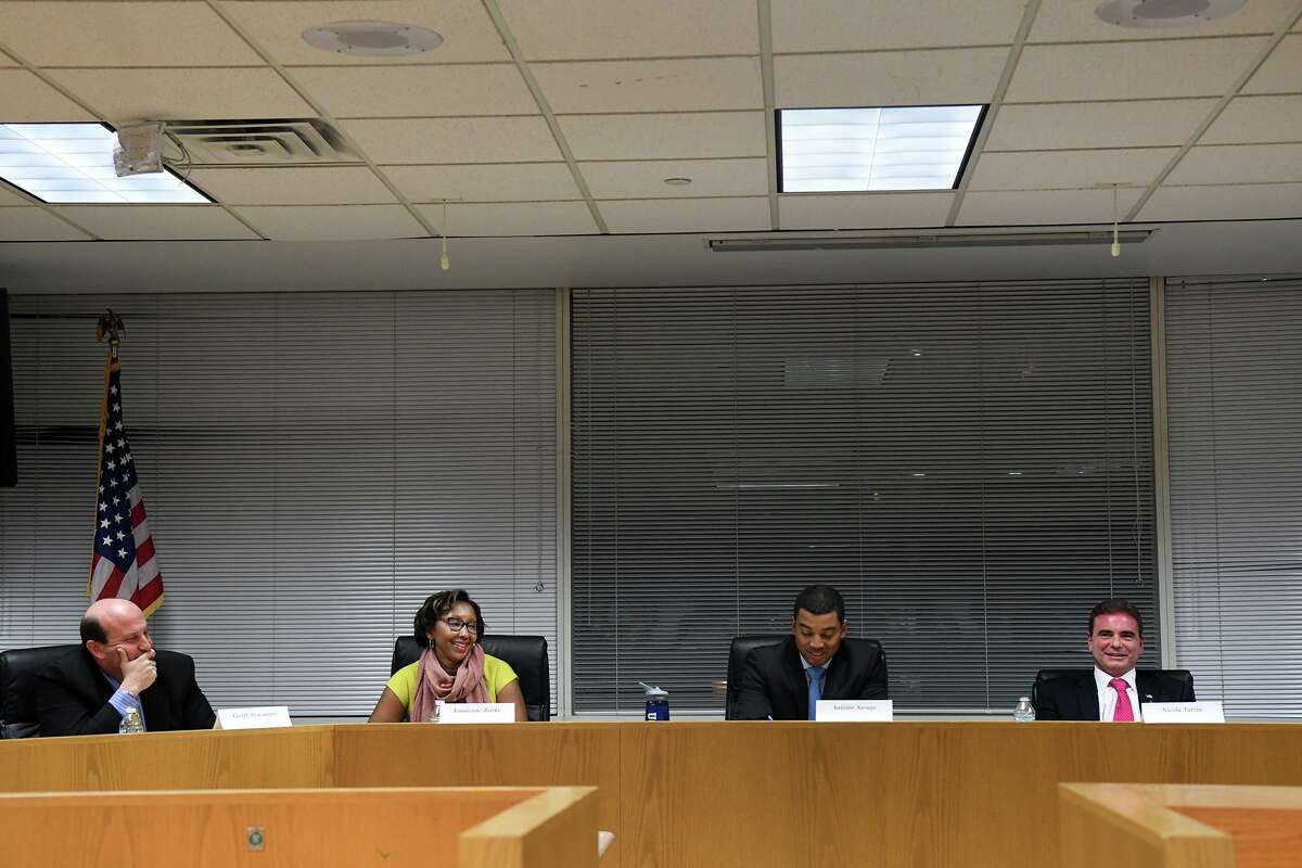 Candidates from left, Democrats Geoff Alswanger, Jennienne Burke and Antoine Savage and Republican Nicola Tarzia participate in the Parent-Teacher Council of Stamford's forum with the Board of Education candidates at the Government Center in Stamford, Conn., Oct. 27, 2016.