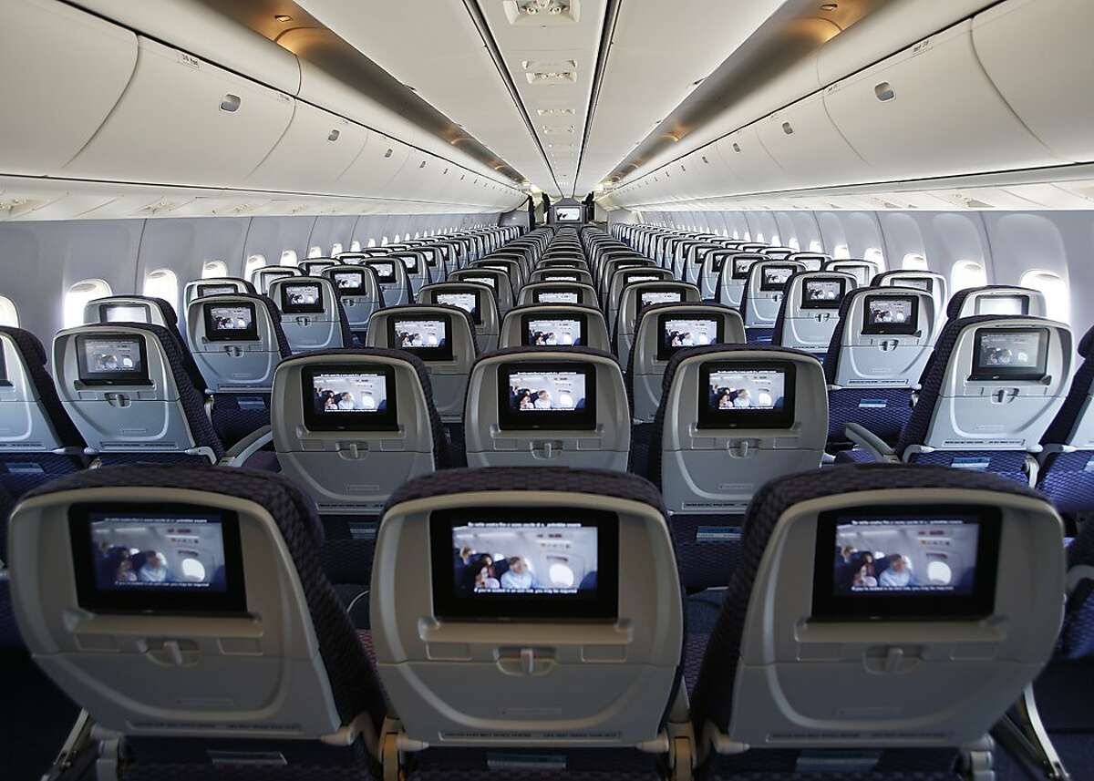 This is a reconfigured Economy cabin in a Boeing 767-300 aircraft, originally from the United fleet. We have completed two of 14 aircraft getting this particular retrofit. With this reconfiguration, every seat has personal, on-demand entertainment. There are power ports at every row, and the overhead bins are larger. Previously, the aircraft had smaller bins, no power ports, and the movies played from screens mounted to the ceilings.