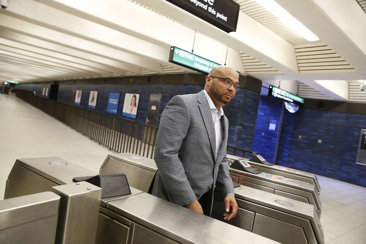 BART’s deputy general manager Michael Jones walks through a turnstile after riding a BART train on Monday October 7, 2019 in Oakland, Calif.