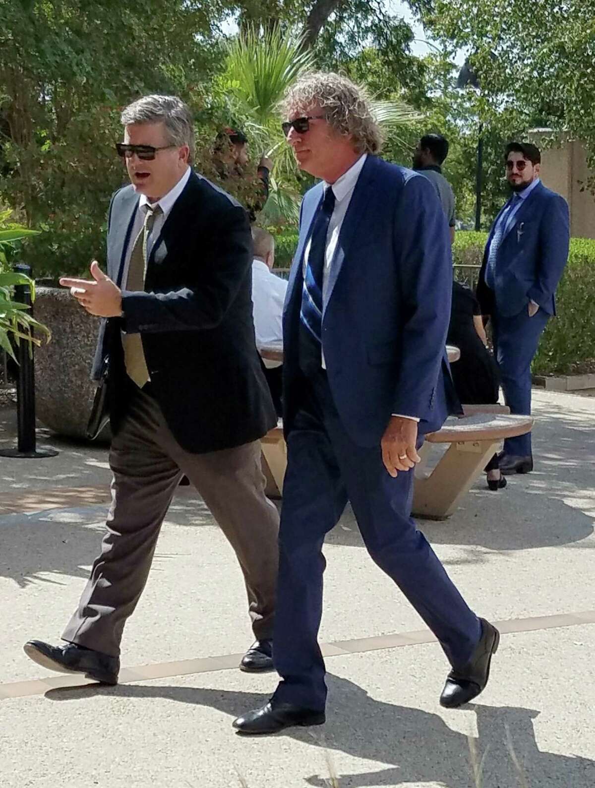Consultant Duane Gordy, right, walks into San Antonio's federal court with his lawyer, Tylden Shaeffer, on Wednesday, Oct. 9, 2019, to plead guilty to a federal tax charge that ends an FBI and IRS investigation that initially focused on former Texas Sen. Carlos Uresti.
