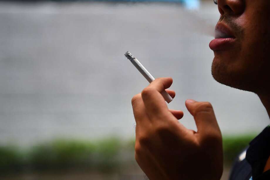 A COVID-19 study in the Paris hospital network found that the percentage of patients who are also regular smokers was dramatically less than the percentage of smokers in the general population. The findings suggest smoking may offer some protection against the disease, researchers say. Photo: Lillian Suwanrumpha, AFP/Getty Images