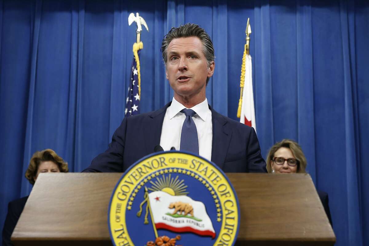 FILE - In this July 23, 2019, file photo, California Gov. Gavin Newsom speaks at a news conference in Sacramento, Calif. The NCAA’s Board of Governors is urging Gov. Gavin Newsom not to sign a California bill that would allow college athletes to receive money for their names, likenesses or images. In a six-paragraph letter to Newsom, the board said the bill would give California schools an unfair recruiting advantage. As a result, the letter says, the NCAA would declare those schools ineligible for its events. (AP Photo/Rich Pedroncelli, File)