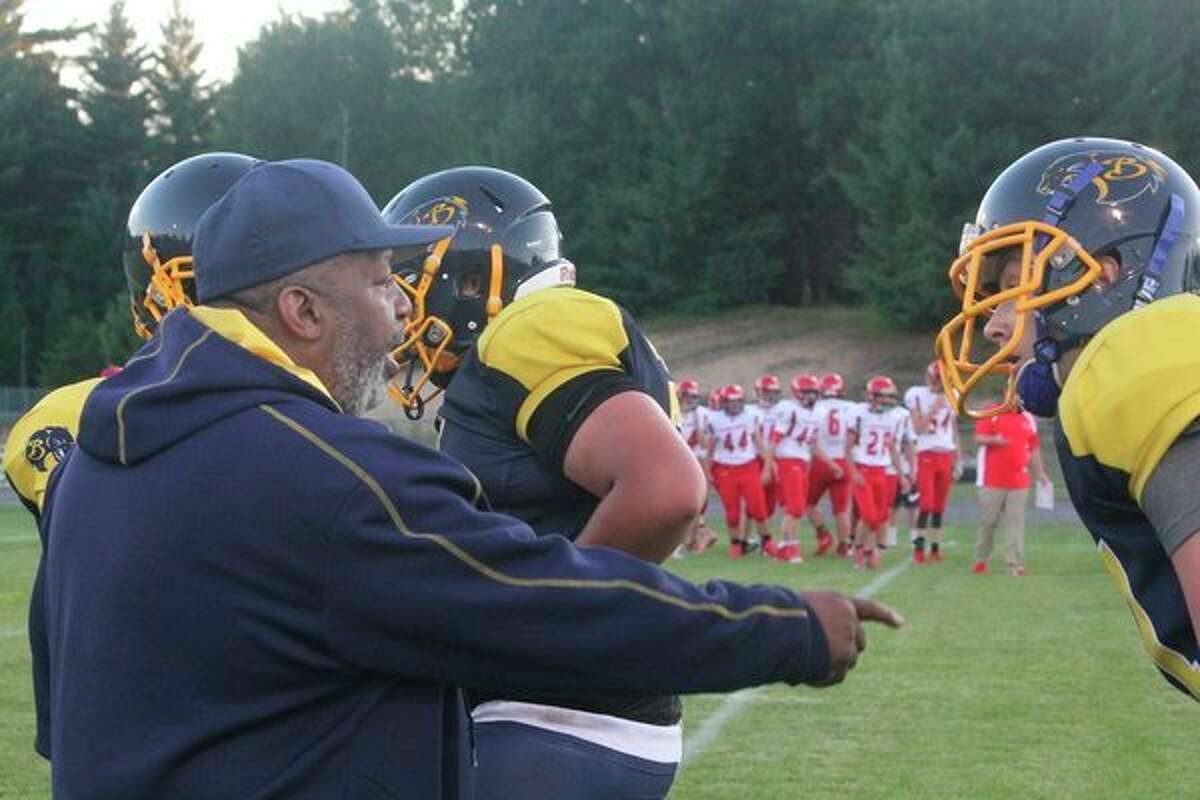 Baldwin football coach Bob Watkins talks with his players; (Star file photo)