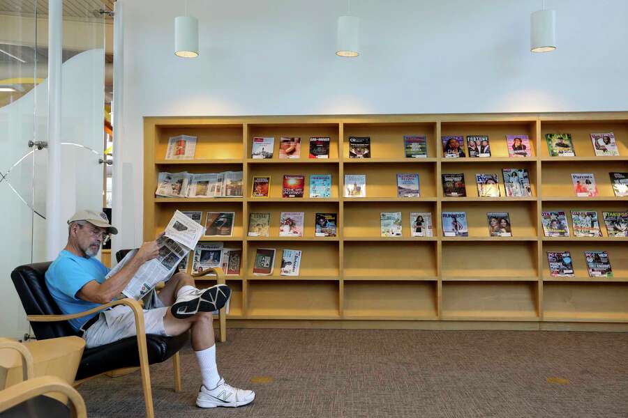 Frank Gallardo reads a newspaper at the McGovern-Stella Link Library Tuesday, Oct. 1, 2019, in Houston. Two years ago, this library was one of 12 library branches in Houston and Harris County to close due to water damage from Hurricane Harvey.