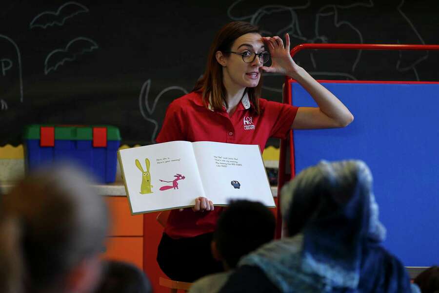 Youth manager Caitlin Campbell leads a story time reading for toddlers inside the McGovern-Stella Link Library Tuesday, Oct. 1, 2019, in Houston. Two years ago, this library was one of 12 library branches in Houston and Harris County to close due to water damage from Hurricane Harvey.