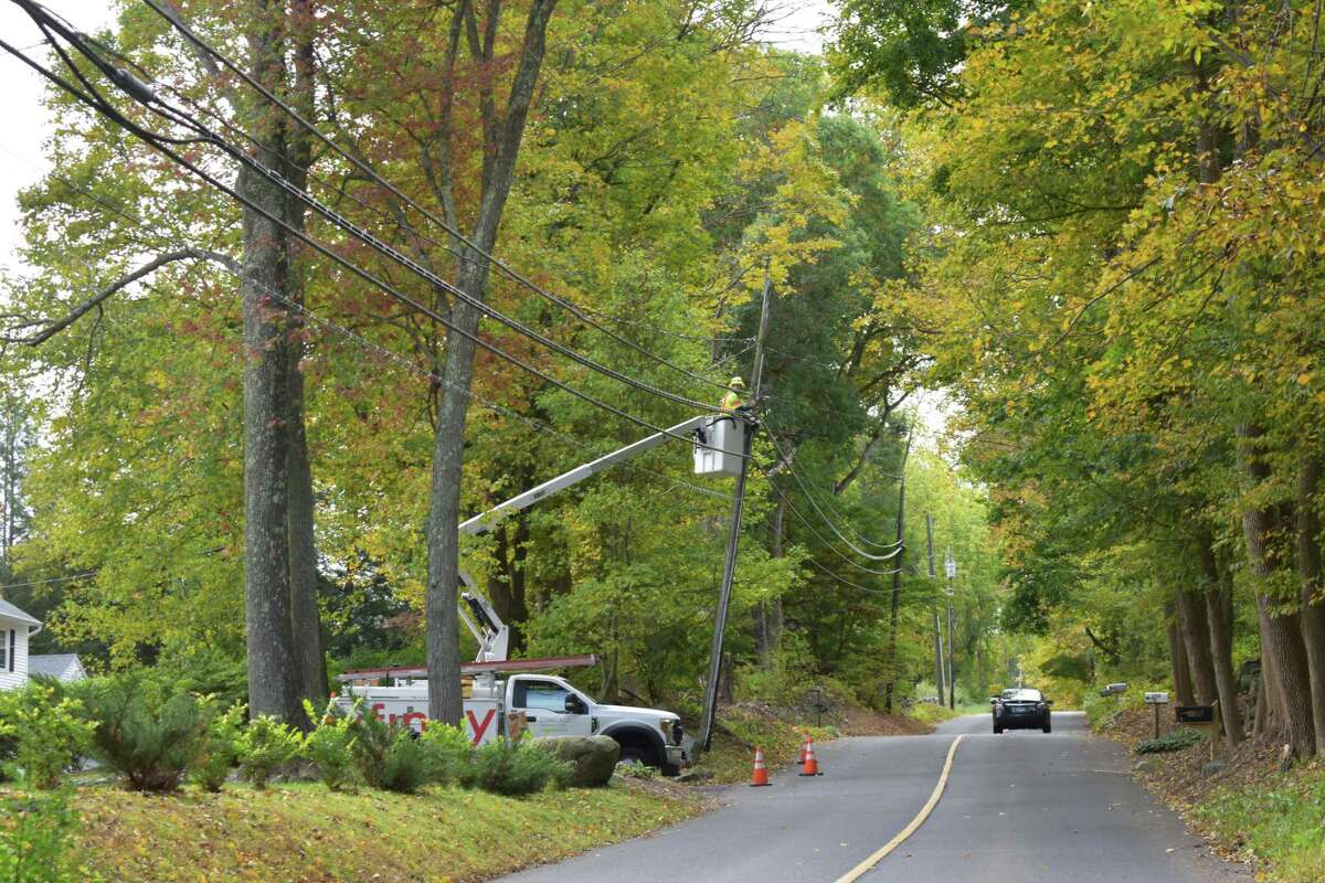 A Comcast technician working lines on Thursday, Oct. 10, 2019, in Bethel, Conn., the day the company announced a big boost to its Xfinity broadband speeds throughout its Northeast territories.