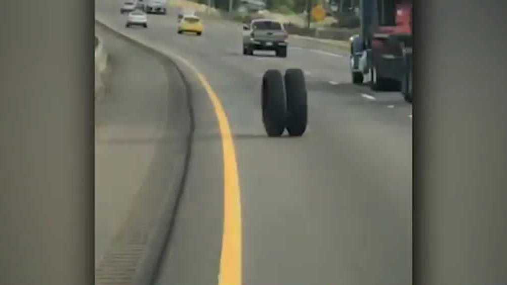 VIDEO Loose tire rolls down the highway, crosses into traffic