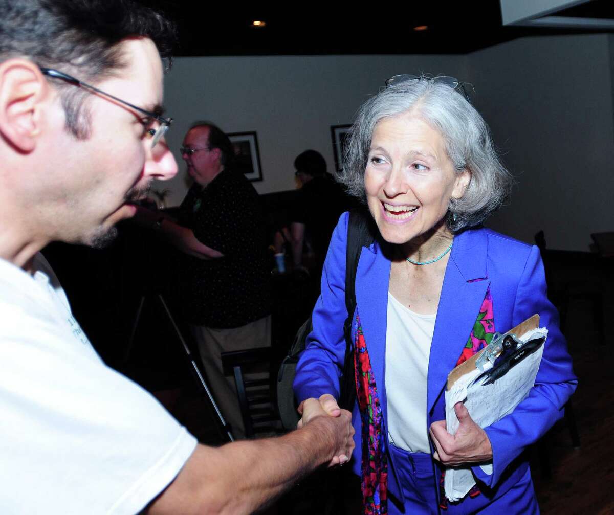 Rolf Maurer (left) of Stamford shakes hands with Green Party presidential candidate Jill Stein (right) at the Winchester Restaurant in Woodbridge on 6/29/2012. Photo by Arnold Gold/New Haven Register AG0454E
