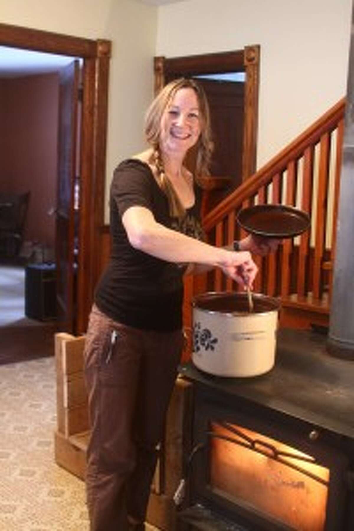 IMMERING: Brooke Whipple stirs a pot of borscht soup on top of her wood stove in her home. “It’s definitely a winter soup and the nice things once it’s all together, I can put in the Crock Pot or on the wood stove and just let it simmer all day,” Whipple said.