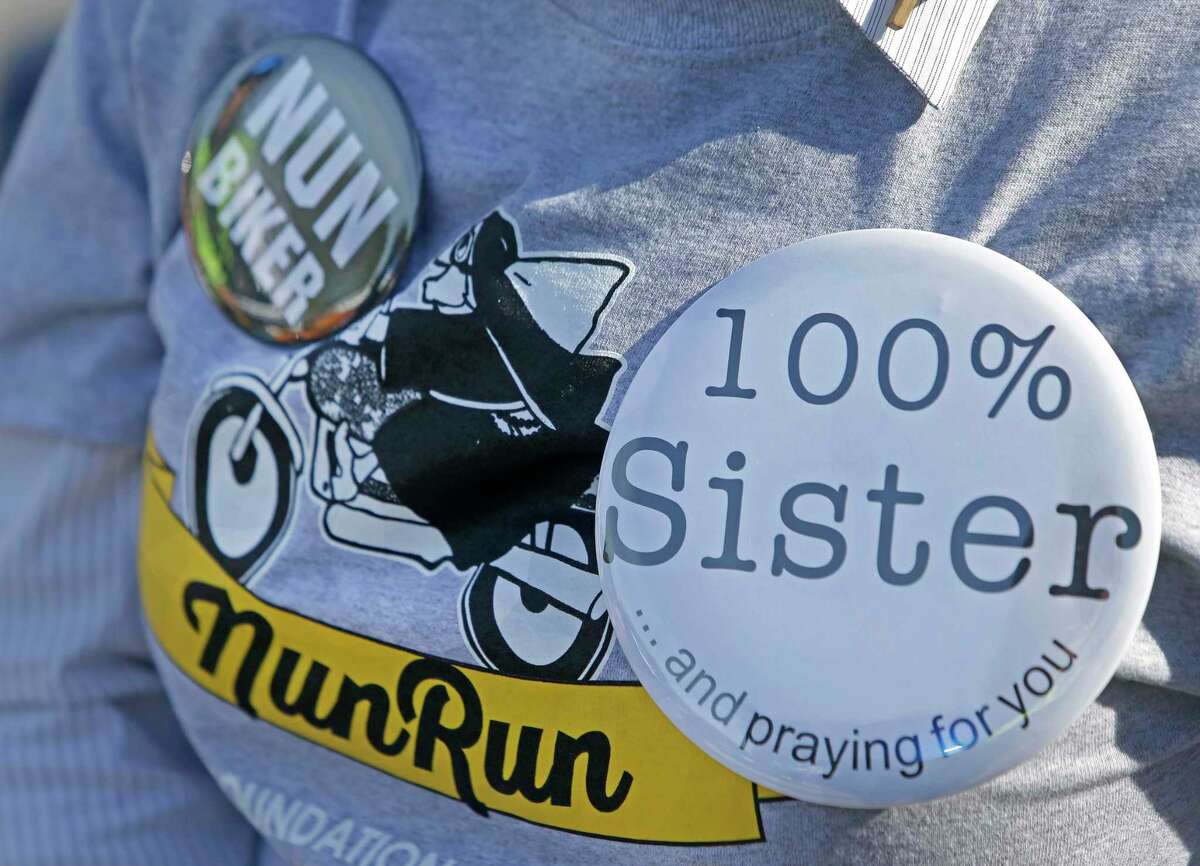 Sister Anita Brenek displays buttons saying nun biker and 100 percent sister on her t-shirt during of the 11th Annual Nun Run at St. Austin Center, 2002 S. Wayside Drive, Saturday, Oct. 17, 2015, in Houston. The 40 mile ride to San Leon benefits the CHRISTUS Foundation for HealthCare school-based clinics, which provide healthcare to children on campus in 17 low-income neighborhood schools. ( Melissa Phillip / Houston Chronicle )