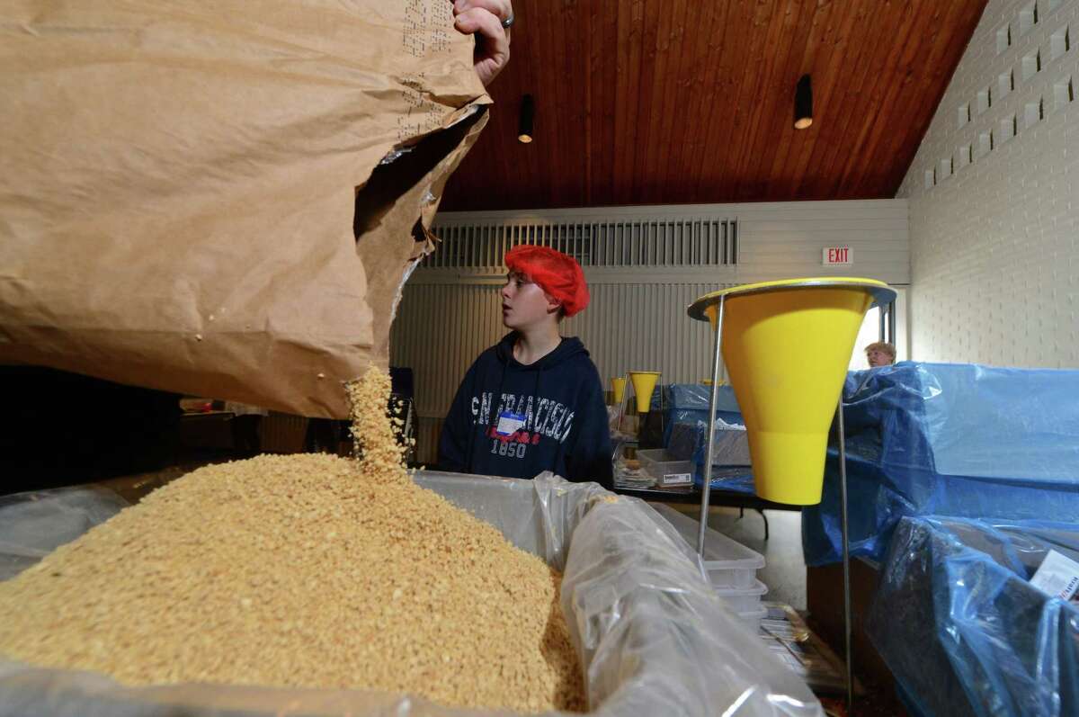 More than 700 volunteers will help the Wilton Interfaith Action Committee pack nutritious meals for malnourished children at Rise Against Hunger event at St. Matthew's Episcopal Church on Saturday, Oct. 20.