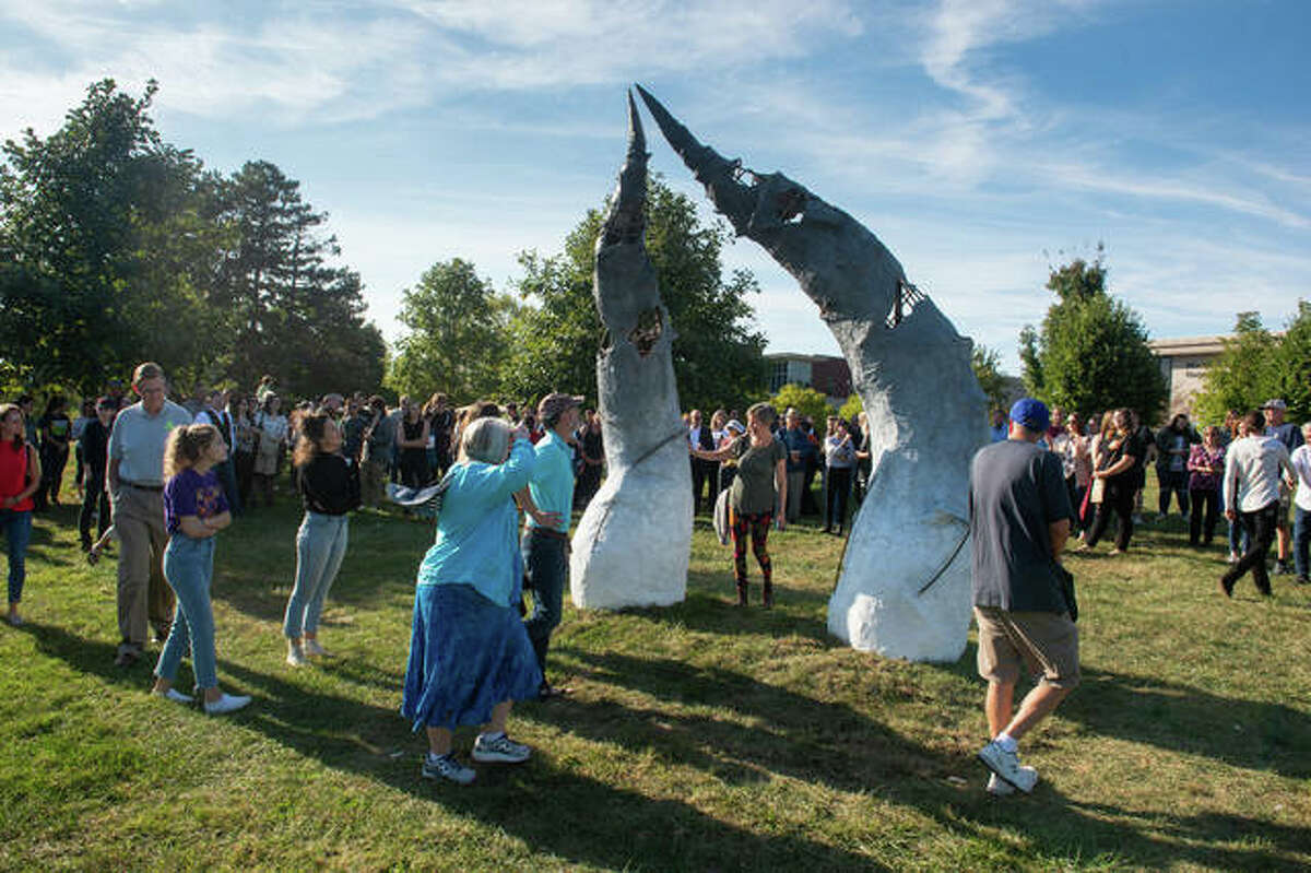 Visitors admire “Revival” by Abbi during the 18th annual Arts Sculpture Walk on the campus of SIUE.