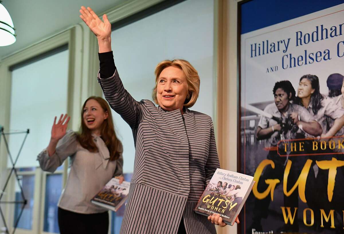Former US Secretary of State and First Lady Hillary Rodham Clinton (R) and Chelsea Clinton arrive to the book signing of their new book "The Book of Gutsy Women: Favorite Stories for Courage and Resilience" at Barnes & Noble Union Square on October 3, 2019 in New York City. (Photo by Angela Weiss / AFP) (Photo by ANGELA WEISS/AFP via Getty Images)