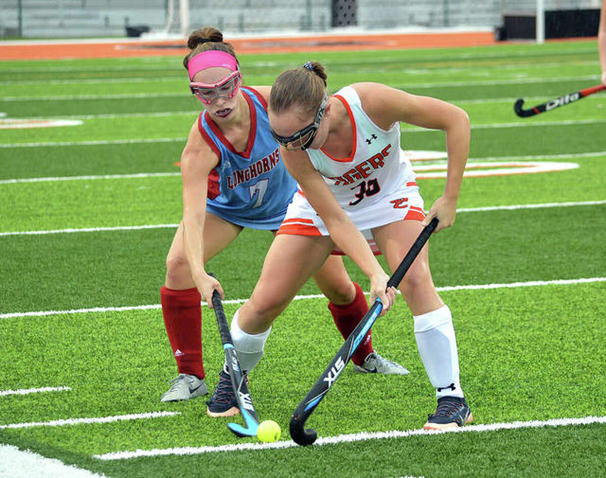 Edwardsville senior Mattie Norton, right, battles for the ball with a Parkway West player during the first half of Thursday’s game at the District 7 Sports Complex.