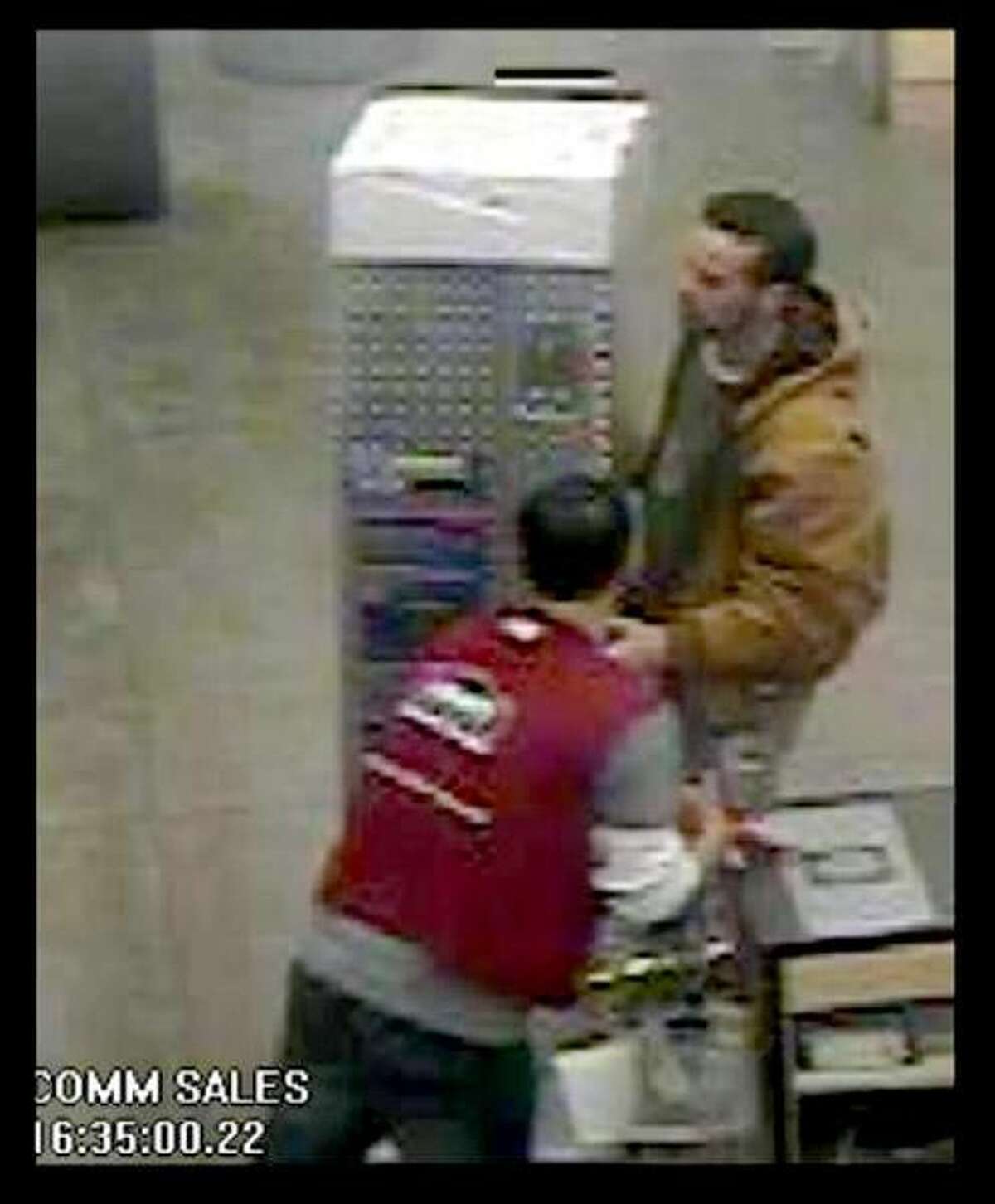 In photo 1 the male is seen leaving the store with a silver pickup truck bed tool box.