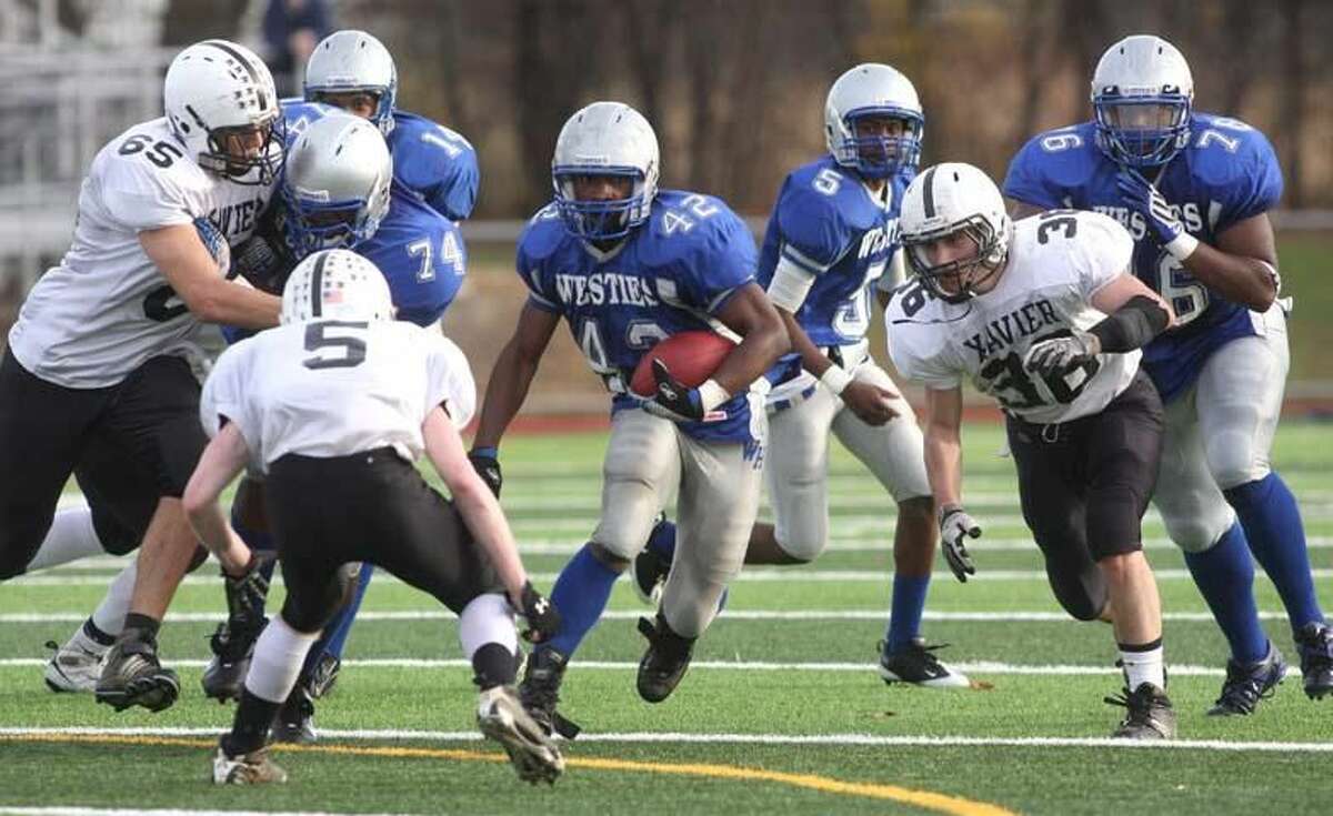 West Haven's Devante Credle looks for room to run against Xavier. (Photo by Russ McCreven)