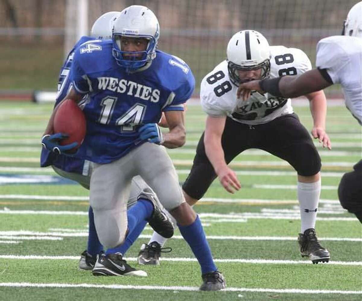 West Haven's Marquies Highsmith runs through the Xavier defense in the Westies' 28-0 loss. (Photo by Russ McCreven)