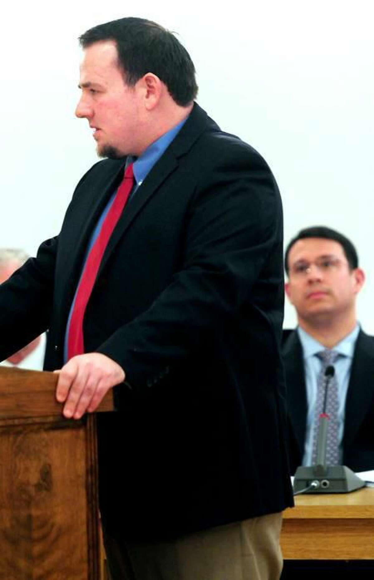 Ward Willis, left, speaks before the Board of Aldermen at City Hall in Milford before being approved for a position on the Planning and Zoning Board. Arnold Gold/Register