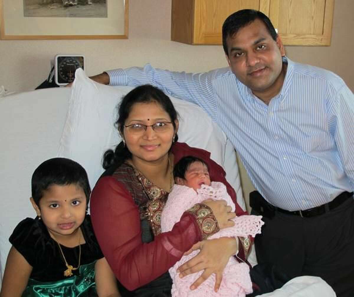 Submitted Photo The Kurra/Vemineni Family of Milford welcomed Milford’s first baby of 2012. Pictured left to right are Priyanka Kurra, 4; Srilakshmi Vemineni holding newborn Aiswarya Kurra; and Kishor Kurra.