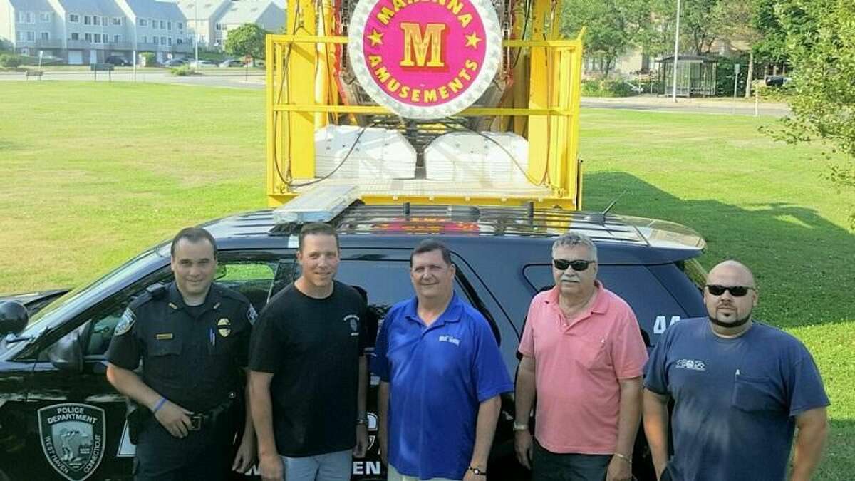 PHOTO CONTRIBUTED BY DAVID O'BRIEN From left, West Haven Police Department Detective Robert Fazzino, vice president of the police union; Detective Sean Faughnan, union president; Mayor Ed O'Brien, George Marenna Jr. and George Marenna III.