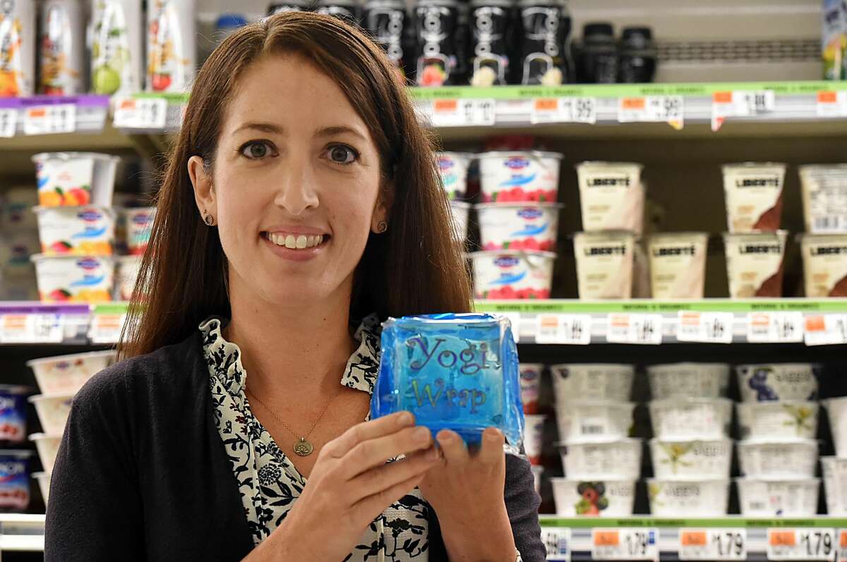 Fourth-grade teacher and mother of two Teri Alves, of Orange, is photographed in a local grocery store with her invention, the Yogi Wrap Sept. 27, 2016. Alves, who survived the Sandy Hook shooting, used her experience as post-traumatic growth to invent the lunchbox-sized yogurt ice pack. (Catherine Avalone/New Haven Register)