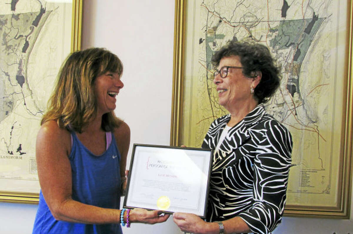 First Selectman Ellen Scalettar, right, recognizes Kate Brown as the October Woodbridge Person of the Month for October.