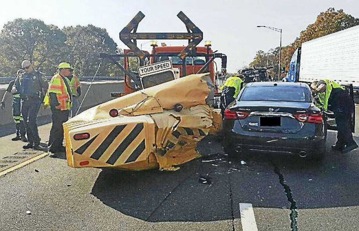 Two people were taken to the hospital Wednesday after their car crashed into the back of a state construction vehicle on Interstate 95 in Milford. Police are reminding people they must slow down and move over if they see the trucks stopped on the highway.