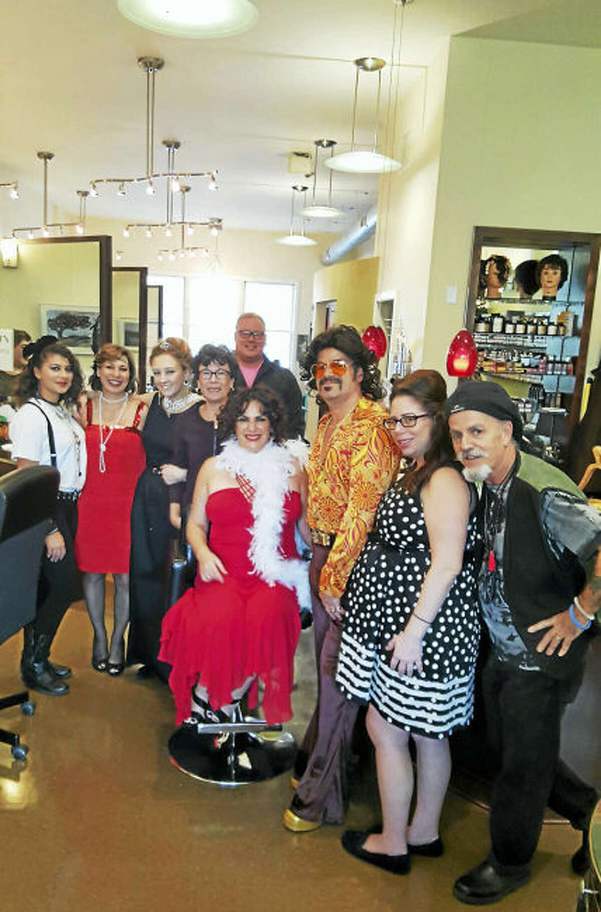 From left, Progressions Salon & Wig Boutique’s staff members Haley Conway, Jean Demayo and Kourtney Hargaray; Woodbridge First Selectman Ellen Scalettar, Victor Ranero; co-owner Stephanie Cabral, Keith Proto, Jennifer Adelman and co-owner Mario Cabral. Not pictured are staff members Diane Kline and Tracy Daniels.