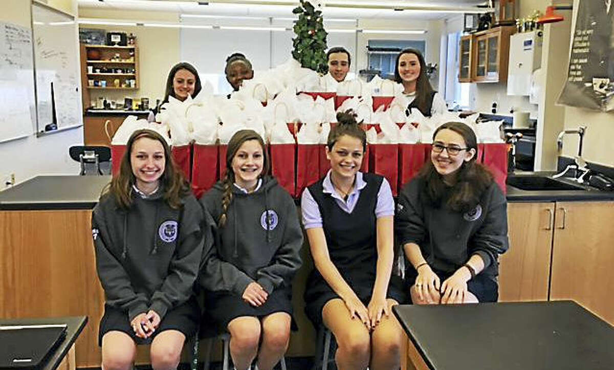 Students from Lauralton Hall, Milford, assembled and delivered 40 gift bags of personal care products, along with five large boxes of replacement items, to the Mercy Learning Center in Bridgeport on Dec. 15. From left, in back, Christiana Cottrell, Ann Papin, Erin O’Connell and Emily Bump; in front, Francesca Norko, Angelina Debenedet, Emma Jacobs and Kathryn Blanco.