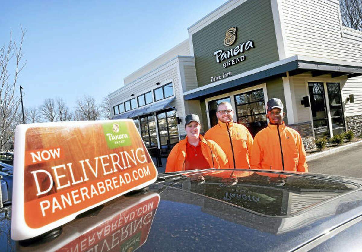 From left, Kristin Dehm, Joshua Webb and Daquan Fraser are the first drivers for a food delivery service for Panera Bread in Milford beginning today.