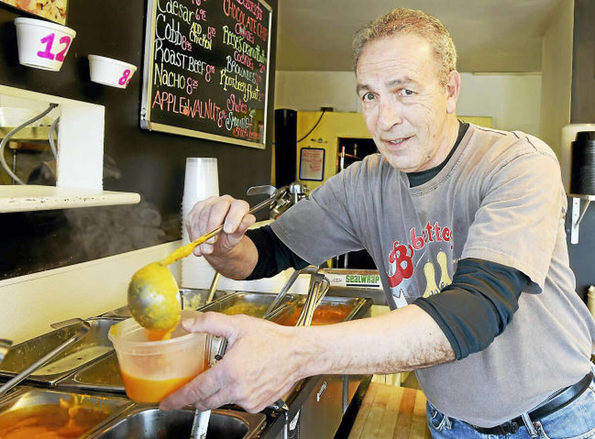 Gary Caulfield, co-owner of Bobette’s in Milford, dishes some soup Feb. 17. The eatery will donate a portion of the proceeds from the sale of butternut squash bisque to the Beth El Center in Milford.