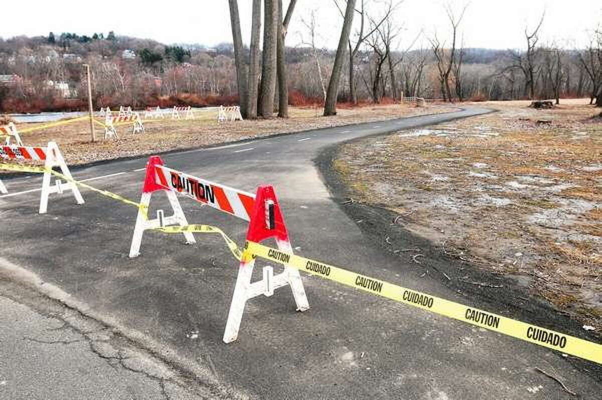 Caution tape prevents pedestrians from entering O’Sullivan Island Recreation Park in Derby.