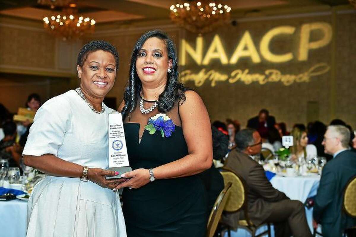 NAACP Greater New Haven Branch President Doris J. Dumas, right, presents the Cornell Scott Health Award to Ena Williams at a previous Freedom Fund dinner.