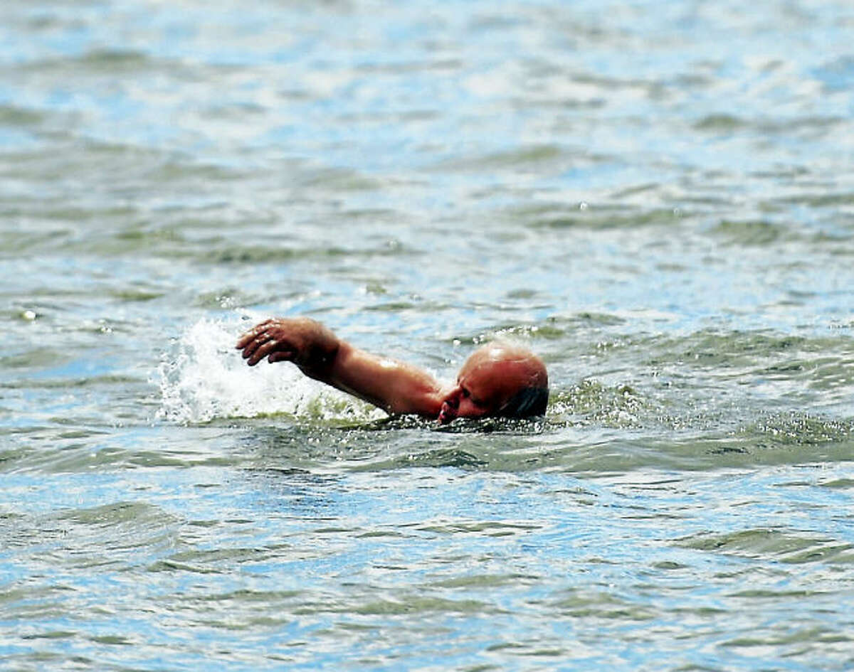 Miles Hayden of Branford, who swims on consecutive days from May into November, is shown swimming near Branford Point at Parker Memorial Park in Branford. Wednesday.