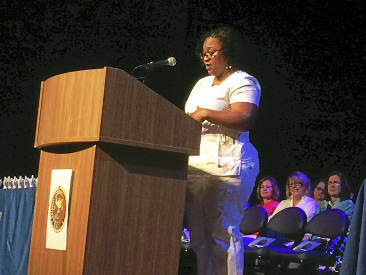 Graduating Gateway Community College Nurse Nicole Bowers gives the student address at the Gateway Nursing Program pinning ceremony Tuesday in the College Street Music Hall.