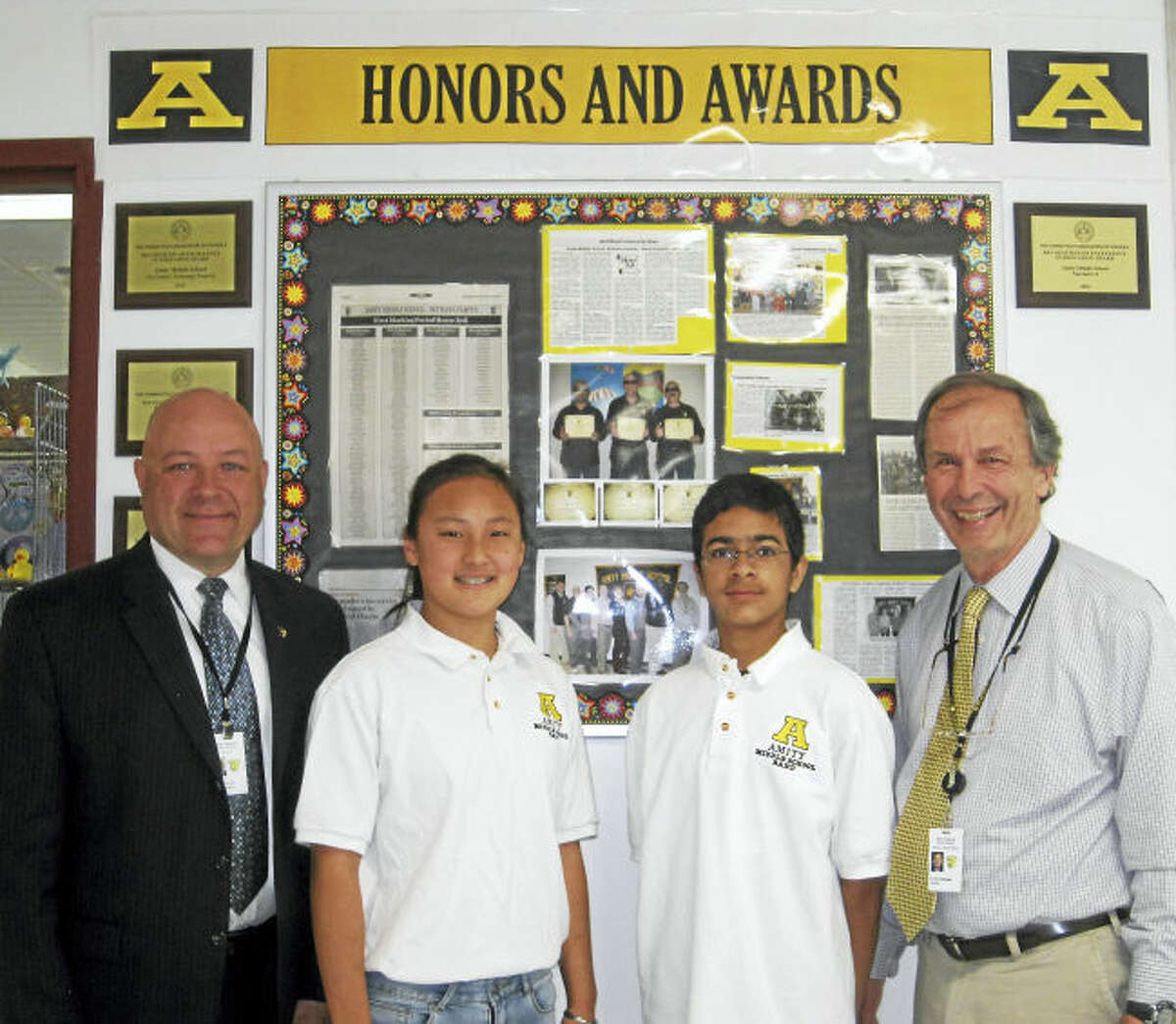 From left, Superintendent Charles Dumais, Clair Yuan, Kabir Khwaja and Principal Richard Dellinger.