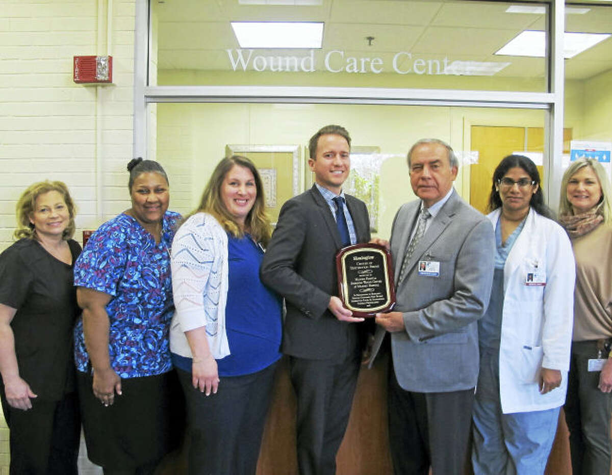 From left, Janice Mezick, RN, clinical manager; Dorothy Bridges, RN; Christina Newton, MPH program director; Josh Cogdill, Healogics assistant vice president; Joseph Pelaccia, president, CEO, Milford Hospital; Dr. Seby Jacob, wound care specialist; and Laurie Sheehan, office assistant.