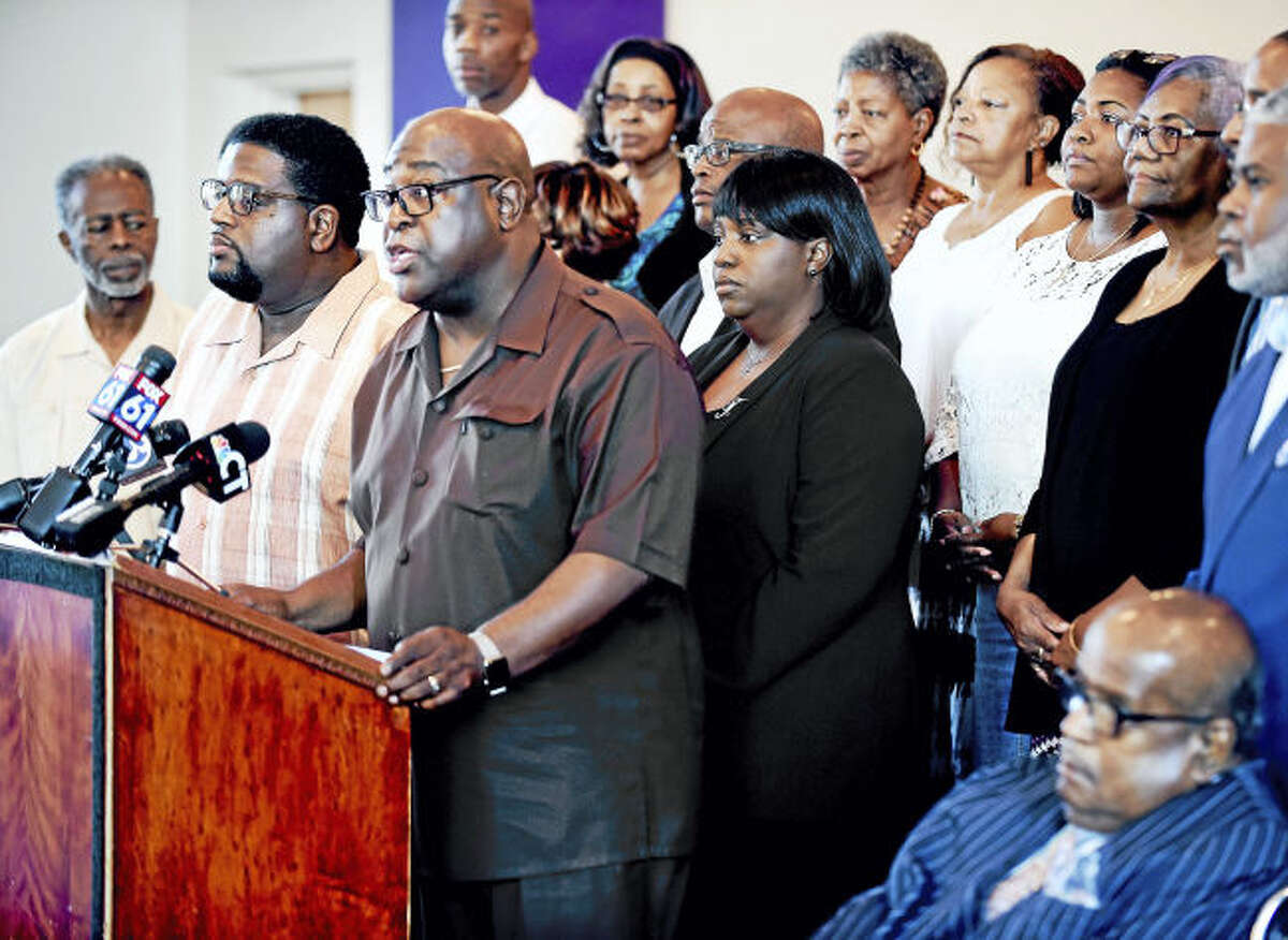 Rev. Boise Kimber (at podium) flanked by clergy and other New Haven faith community members address the violence in Charlottesville and President Donald Trump's statements concerning the violence at a press conference in New Haven on 8/16/2017. Arnold Gold / Hearst Connecticut MediaRev. Boise Kimber (at podium) flanked by clergy and other New Haven faith community members address the violence in Charlottesville and President Donald Trump's statements concerning the violence at a press conference in New Haven on 8/16/2017. Arnold Gold / Hearst Connecticut Media