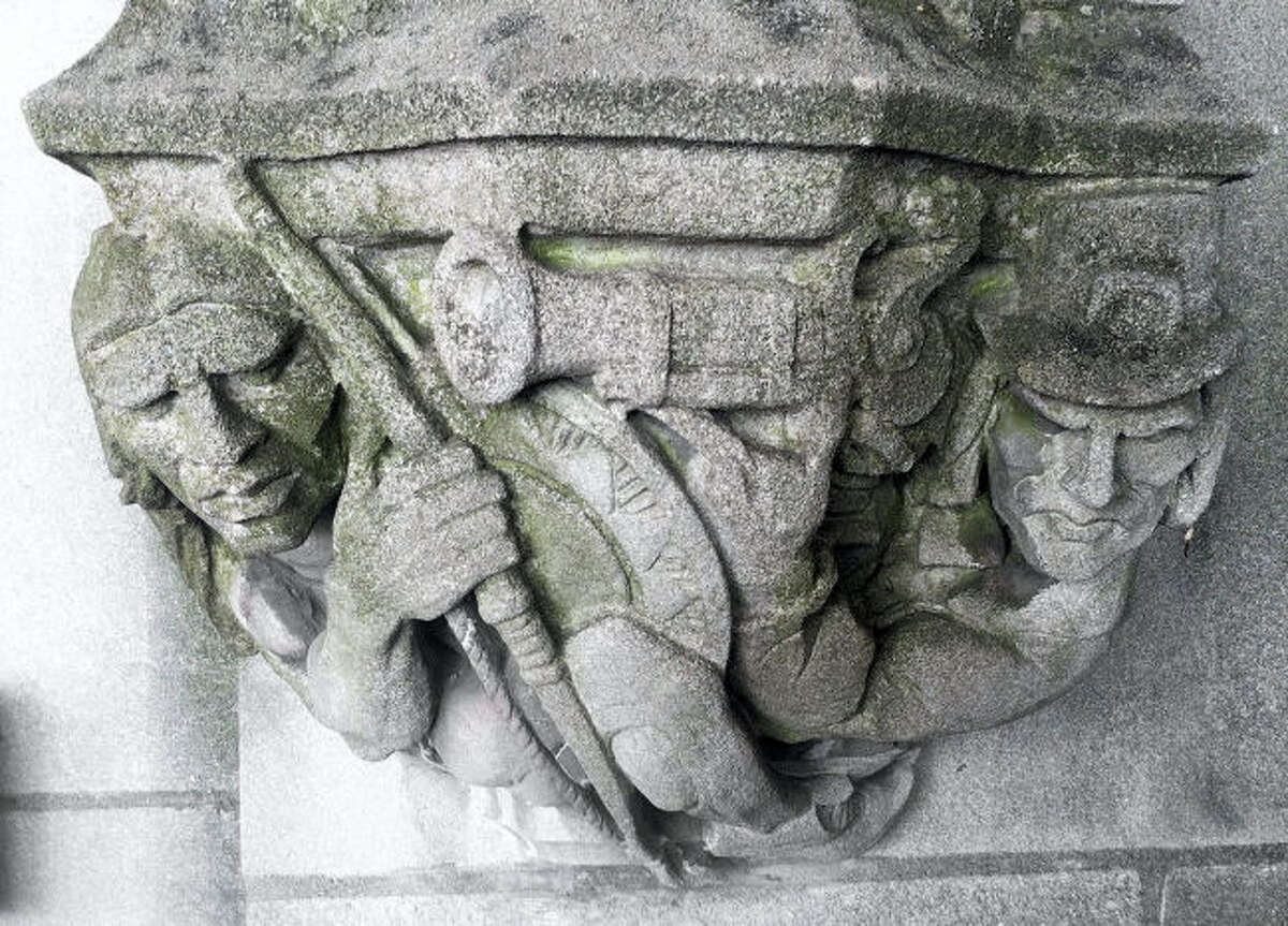 In this May 23, 2013 photo provided by Yale University, a 1929 doorway carving depicts a Puritan settler, right, pointing a musket at the head of a Native American, left, on the school's campus in New Haven, Conn. The musket had been covered by workers with removable stone when the seldom-used doorway was converted into a main entrance. A Yale committee charged with assessing potentially offensive art decided to remove it, but will make it available for public display elsewhere so as to not destroy "reminders of unpleasant history." (Yale University via AP)In this May 23, 2013 photo provided by Yale University, a 1929 doorway carving depicts a Puritan settler, right, pointing a musket at the head of a Native American, left, on the school's campus in New Haven, Conn. The musket had been covered by workers with removable stone when the seldom-used doorway was converted into a main entrance. A Yale committee charged with assessing potentially offensive art decided to remove it, but will make it available for public display elsewhere so as to not destroy "reminders of unpleasant history." (Yale University via AP)