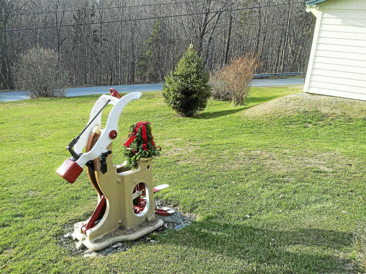 Rudolph the Red-Nosed Reindeer sculpture with the painted red nose, which Paul Keane crested from the Hoffman tailor's press. Contributed photo