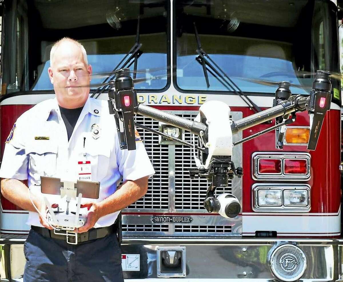 Orange Fire Marshall Tim Smith demonstrating a DJI Inspire 1 drone the fire department received from a $3000 grant from FM Global to the Orange Fire and Police Departments to test drone capabilities in firefighting and police work. 13 members of the Orange Fire and Police Departments have been trained and certified to fly the drone