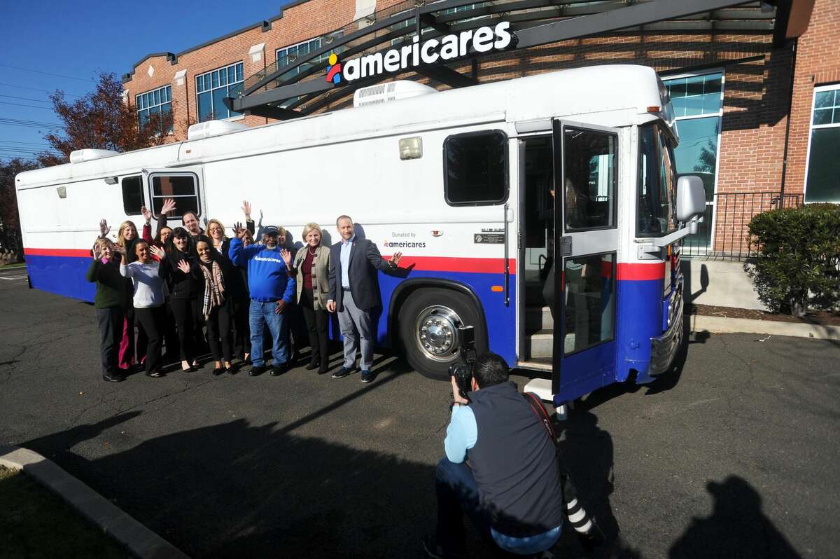 Americares staff bid farewell to its mobile clinic, which is being sent to the Ponce Medical School Foundation in Puerto Rico to provide outreach for survivors of Hurricane Maria, during a sendoff ceremony at the Americares headquarters on Hamilton Avenue in Stamford, Conn. on Tuesday, Nov. 28, 2017.