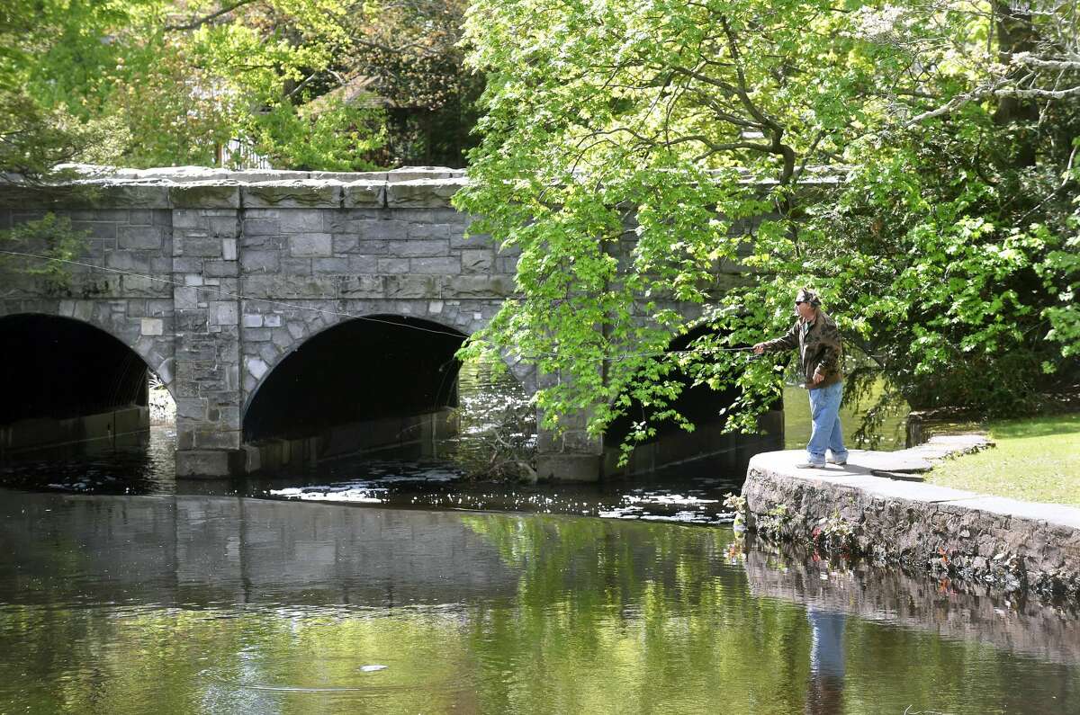 Stephen Stanislawski of Milford fishes at the North Street Duck Pond in Milford.