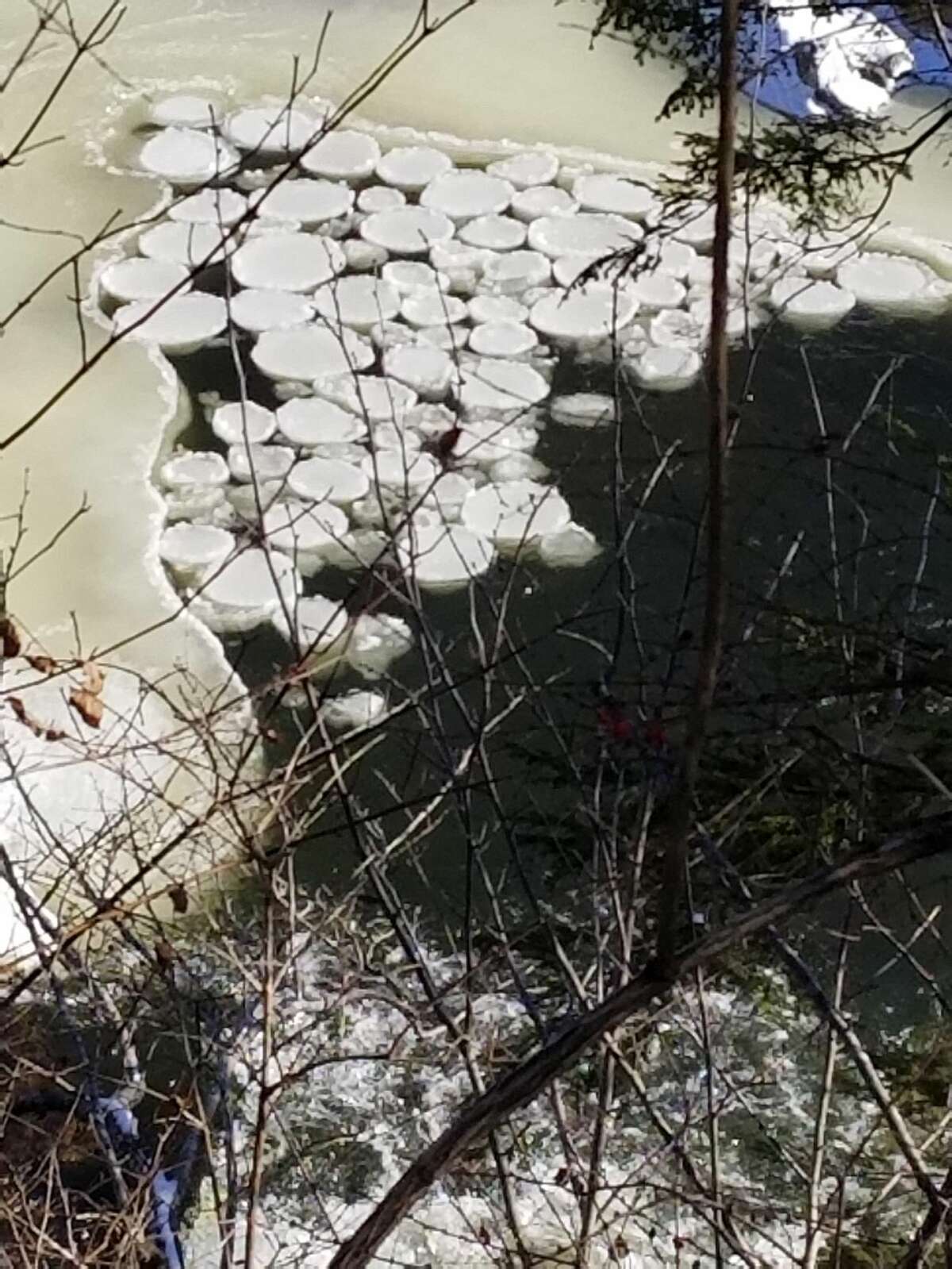 Cliff Bates was hiking the Appalachian Trail Jan. 1 with his dog in 9-degree weather when he saw some slowly-rotating discs of ice on the Housatonic River that resembled UFO saucers.