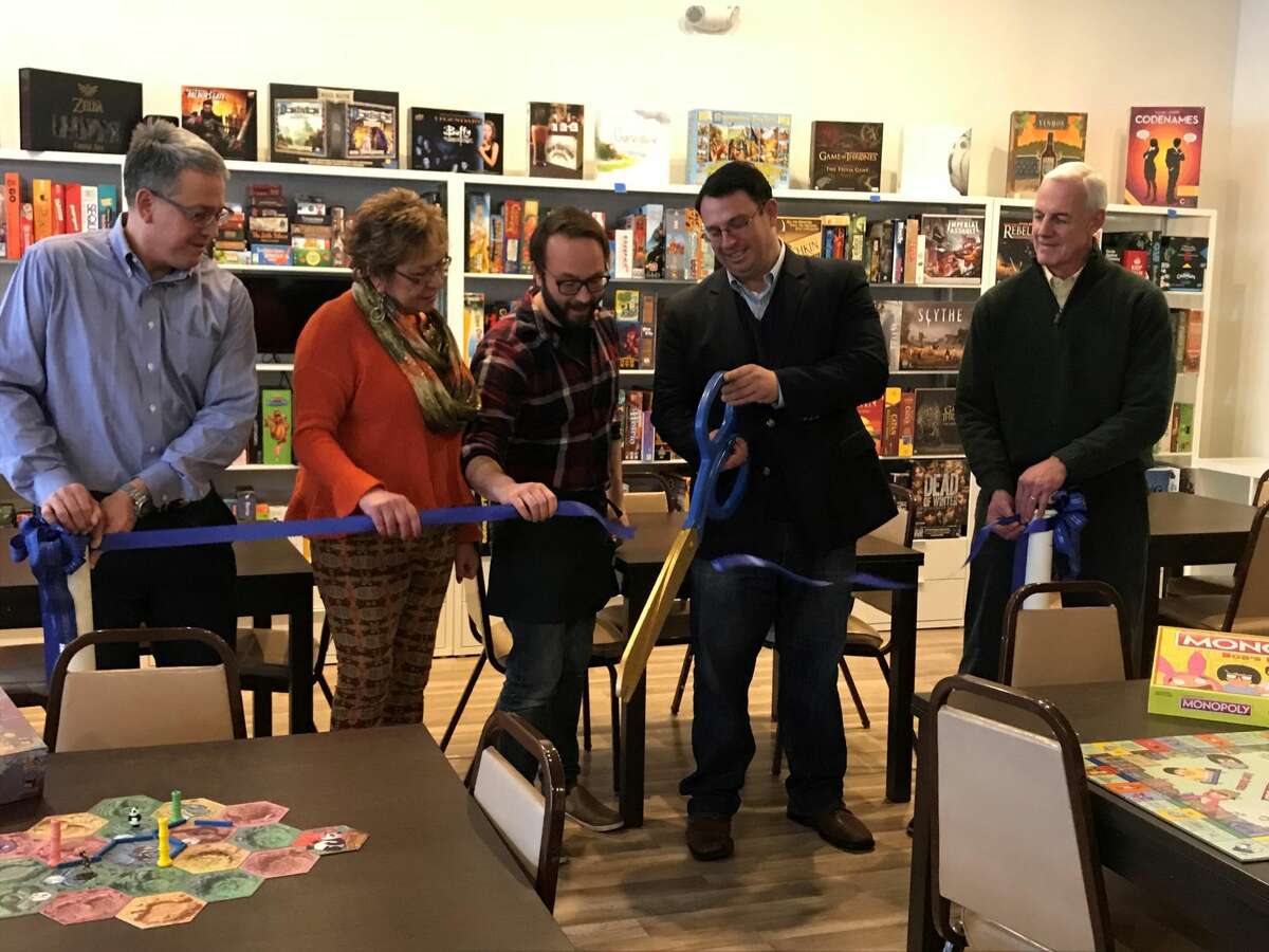 Chamber Chairman Dewey Forbes, State Rep. Kim Rose, Owner Ryan McConnell, Mayor Benjamin Blake and Chamber Executive Director Gary Mullin perform the ribbon cutting ceremony..