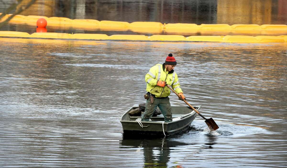 Dredging work of the North Street Duck Pond in Milford.