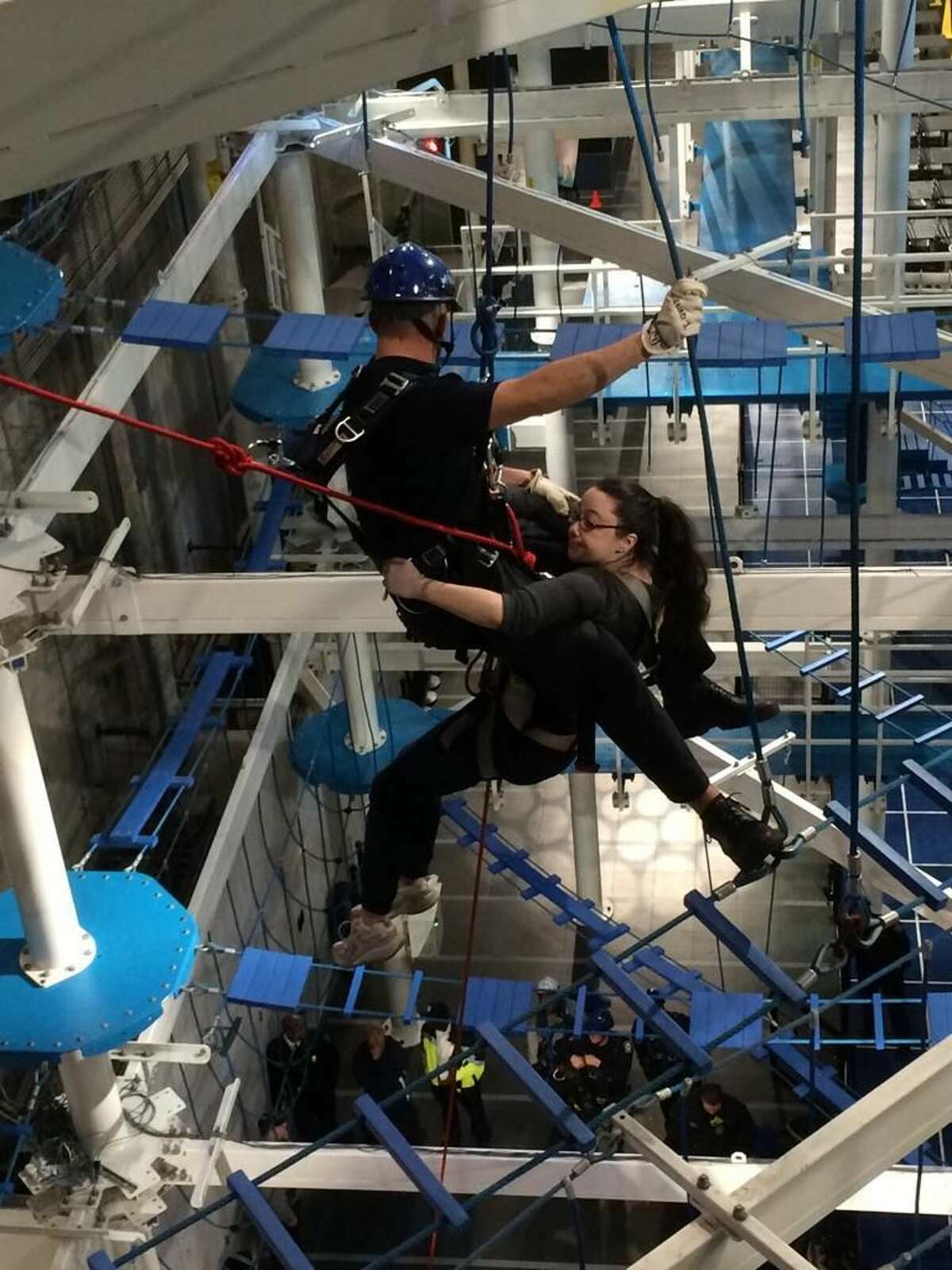 About 15 New Haven firefighters performed a series of training evolutions at Jordan?’s Furniture It Adventure Indoor Ropes Course Friday morning.