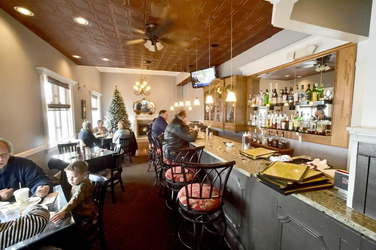 One of three dining rooms includes a bar at the Kimberly Restaurant in Milford.