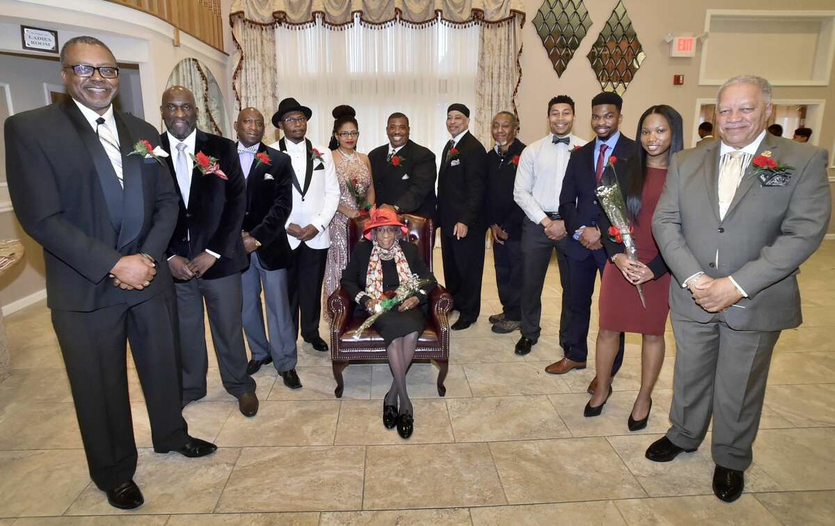 Annie Louther, 103, a special award recipient as the The West Haven Black Coalition Inc. Woman of Distinction, seated center, surrounded by other honorees, left to right standing, Curtis McBride, Edwin Blackwell, Troy Tappin, Ronald M. Douglas, Unique Flynn, Joe Gibson, Jr., Clifton E. Graves, Jr., James L. Chapman, Jr. aka D.J. Tootskee, Dillon Swaine, Richard Miller, Jania Alexis Stewart-James, and Donald R. Lewis.
