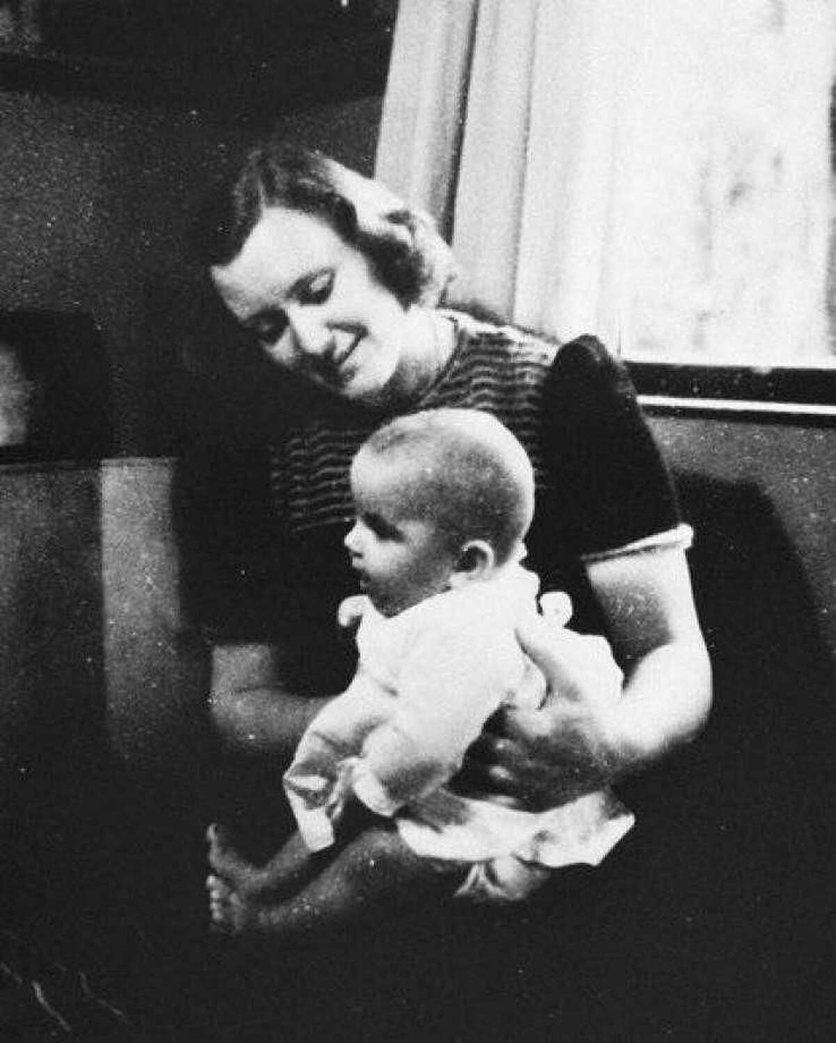 This picture was take in Holland during War War II. Pictured here is Marion Pritchard, who as part of her Nazi resistance efforts sheltered a family of four that included three children, one of them, a baby Erica, is pictured here on her lap. The two reunited years later and Erica, now in her 70s, flew in from Holland to see the late Pritchard honored for her efforts.